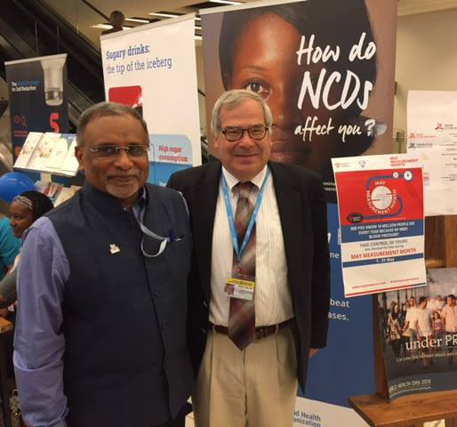 Cherian Varghese receiving recognition at a medical convention